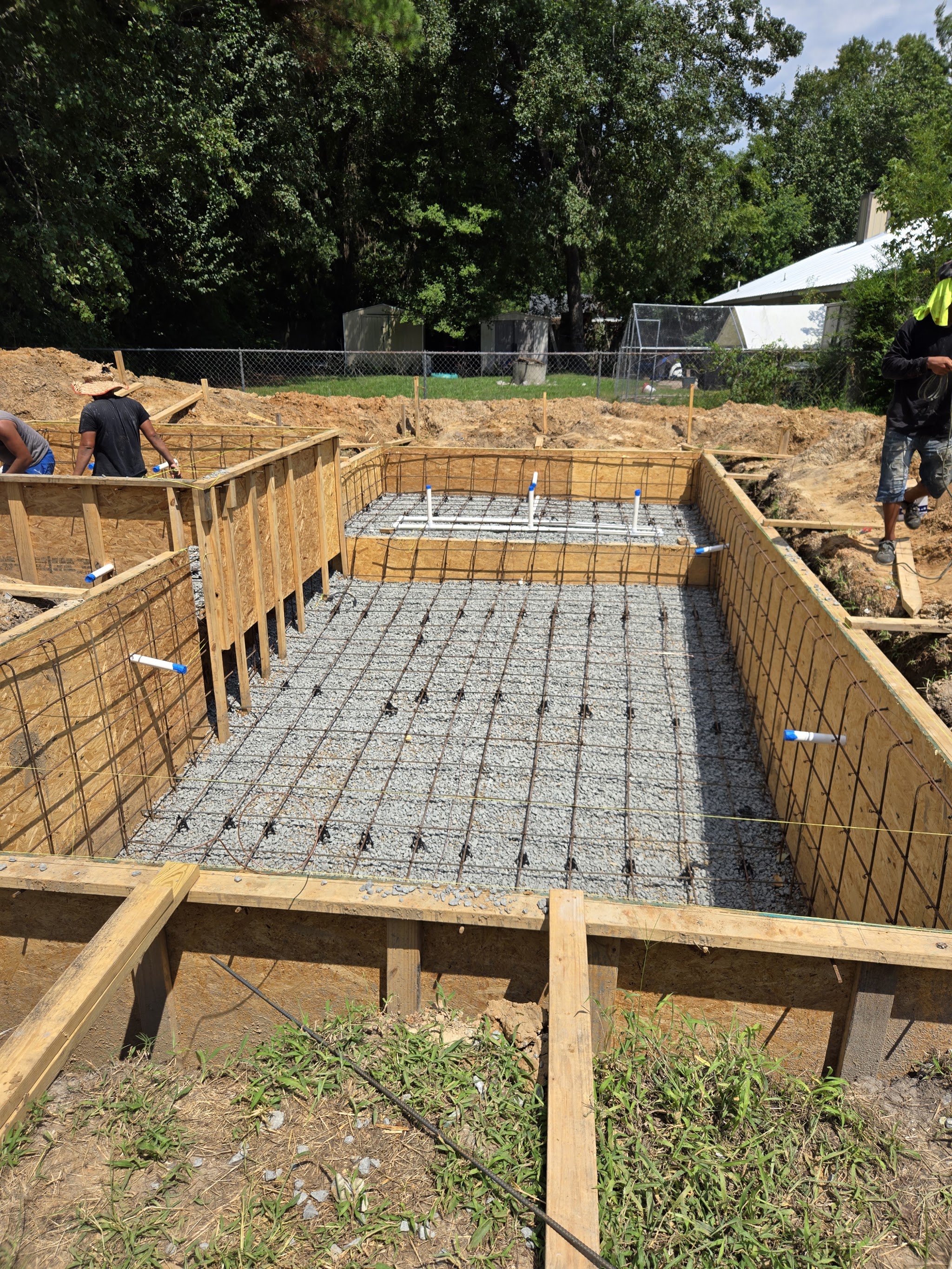 Rebar and wooden forms laid out for a concrete pool